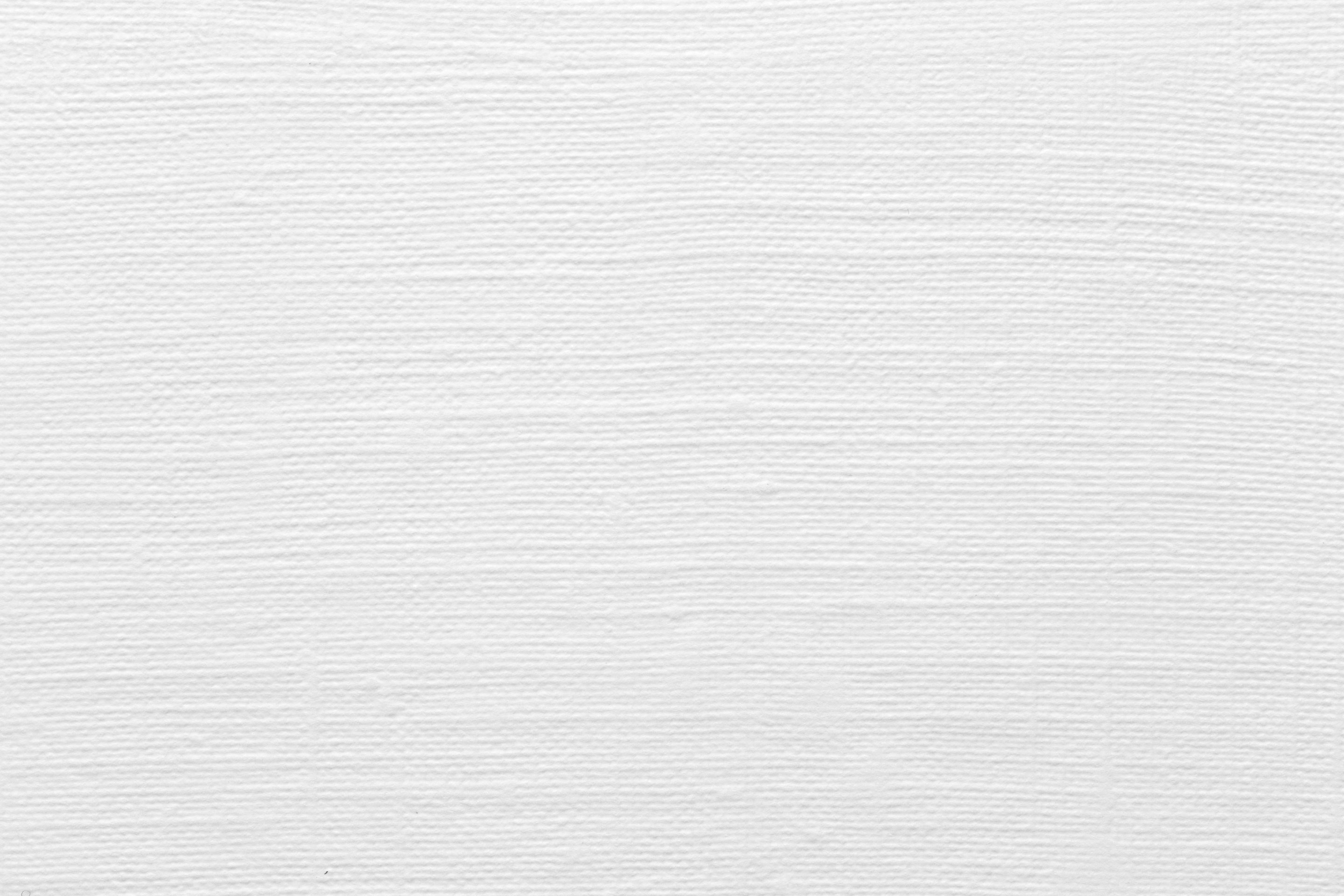 Top view of white linen paper background texture.